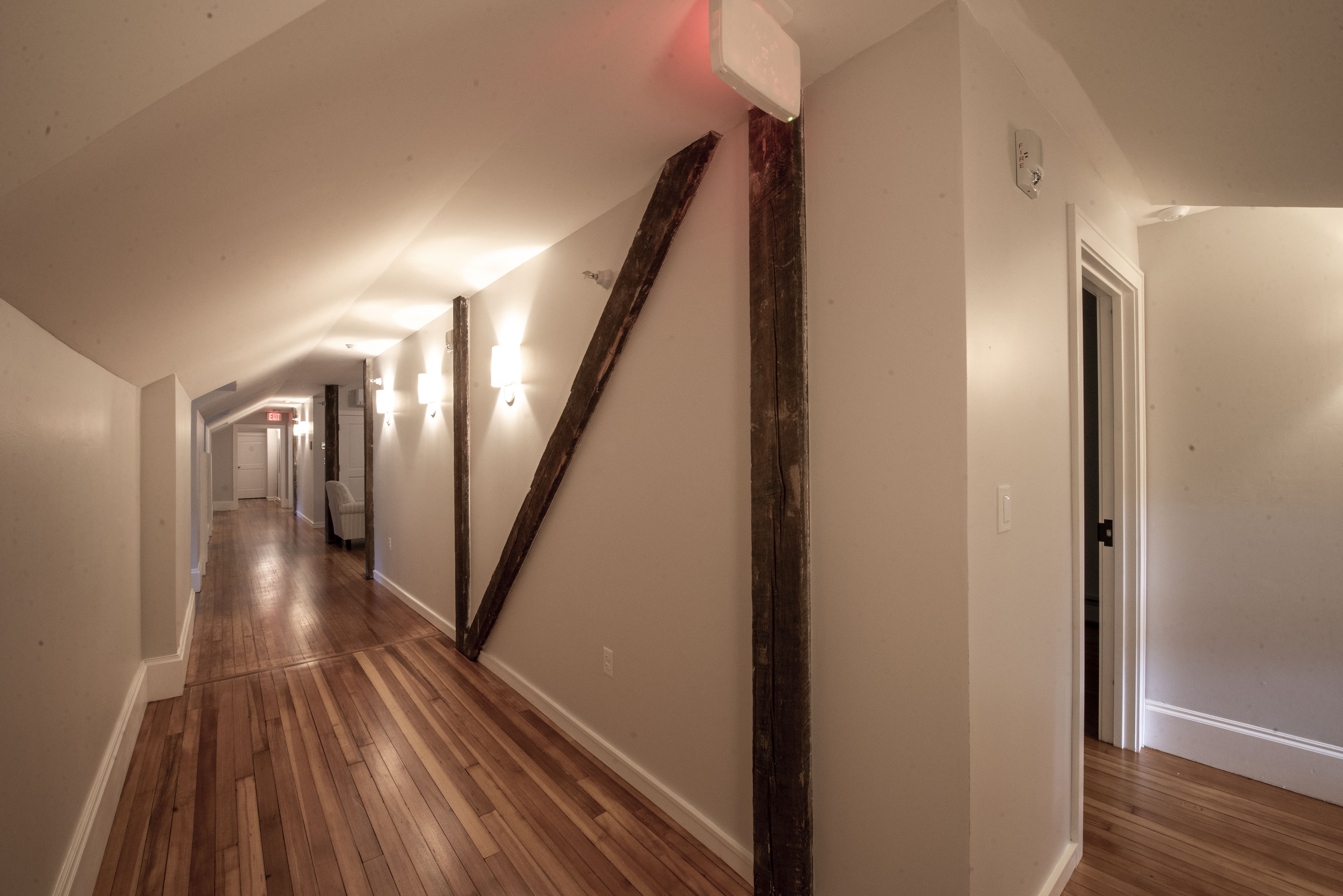 Newly exposed beams in the hallway