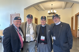 Alumni and board members in Berkeley hats