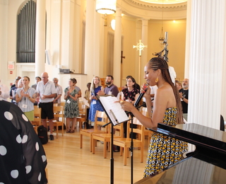 Theodicy Jazz Collective leads fellows in song.