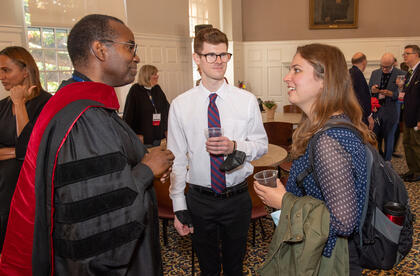 Students Nathan Peace and Sarah Neumann with honorary degree recipient Michael Battle at the recent Convocation